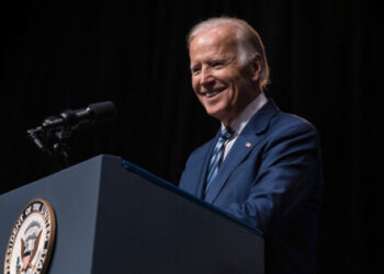 Biden urges technology firms to prioritize safety in AI development